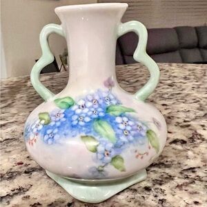 vintage, hand-painted porcelain vase featuring a forget-me-not floral motif.
